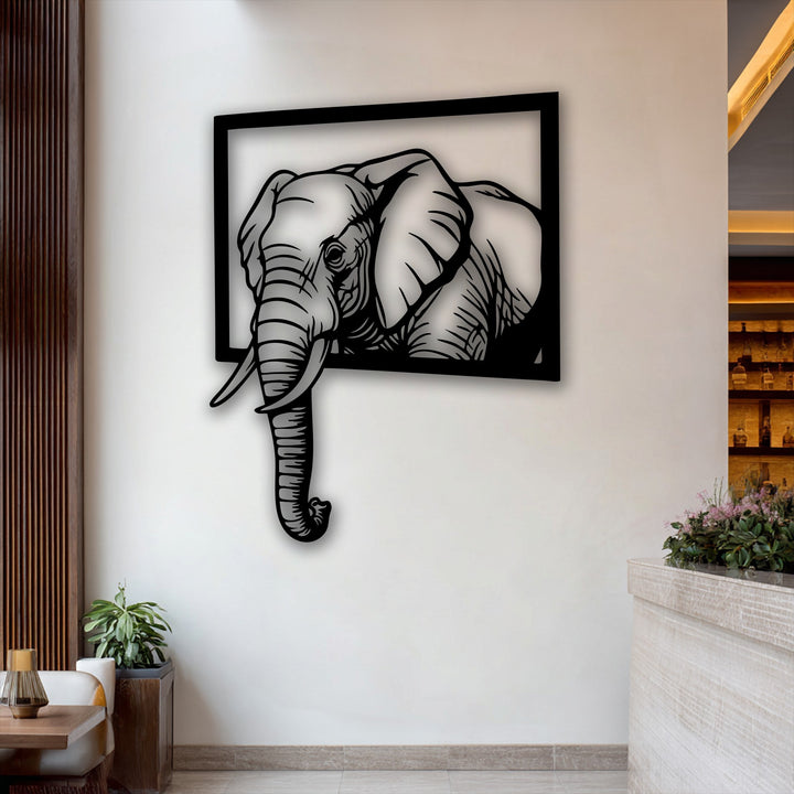 Negative space sculpts a bold, black elephant emerging from a square frame, creating unique metal wall art with a striking 3D effect.