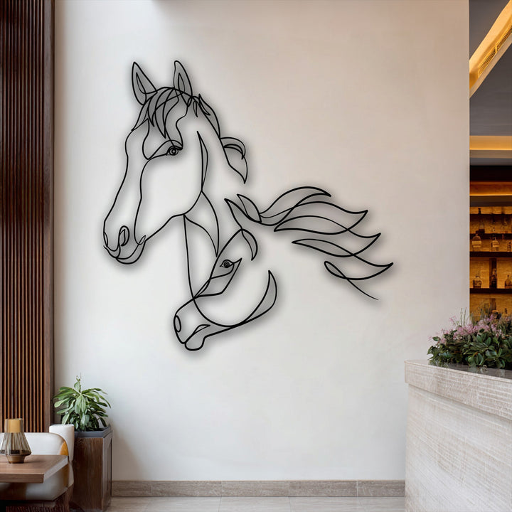 The striking color contrast of the dark flowing horse line art metal artwork creates a dramatic effect against the bright, minimalist wall.