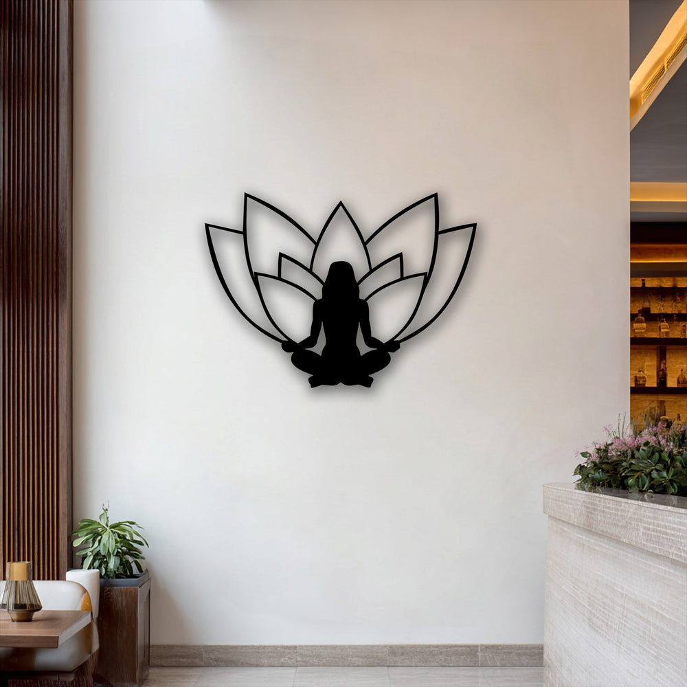 The serene negative space of the white wall perfectly outlines the black lotus meditation silhouette, forming a striking piece of decoration wall art.