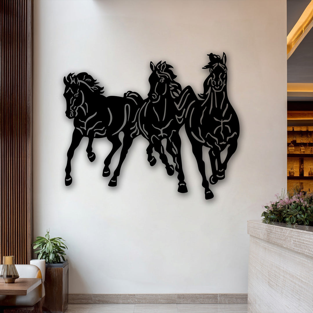 The realistic detail of a unique metal wall art featuring three dynamic galloping horses, their powerful forms and motion vividly captured.