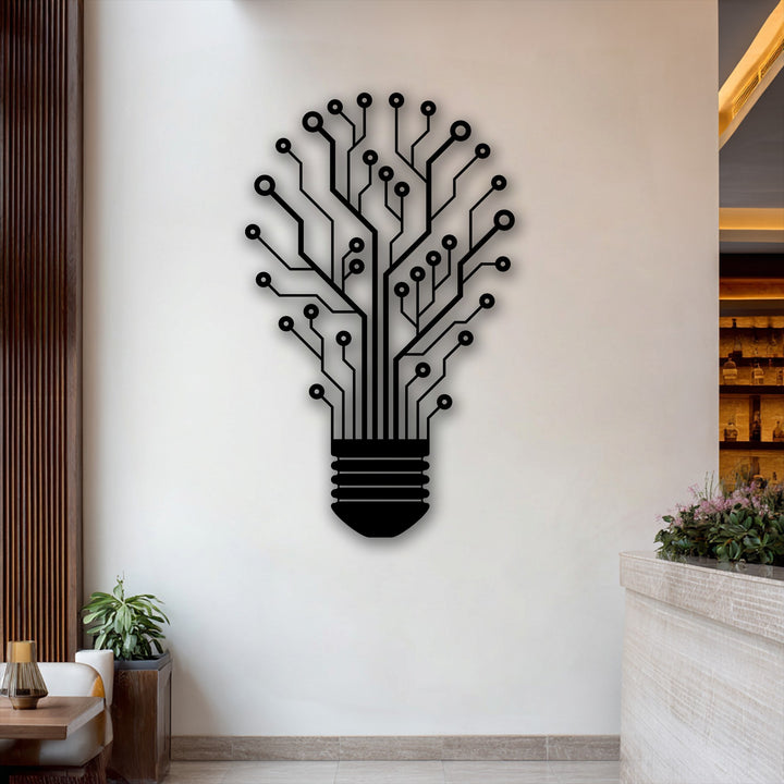 The brightly lit white wall showcases an intricate black lightbulb circuit decorative metal art piece, symbolizing tech innovation and creativity.