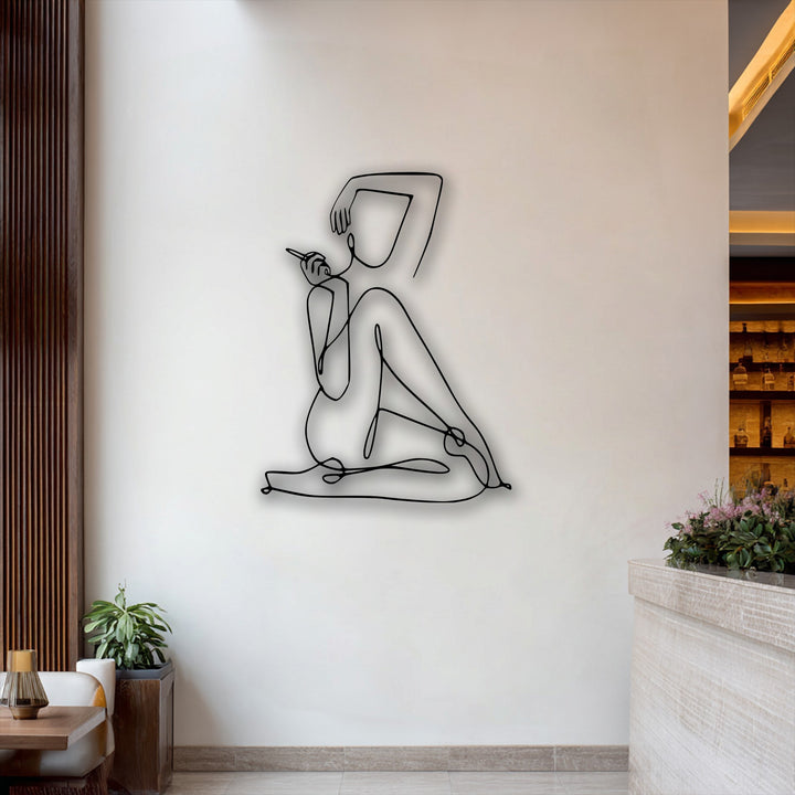 With strong color contrast, the decoration wall art displays a minimalist female line art metal wall decor against a bright white background.