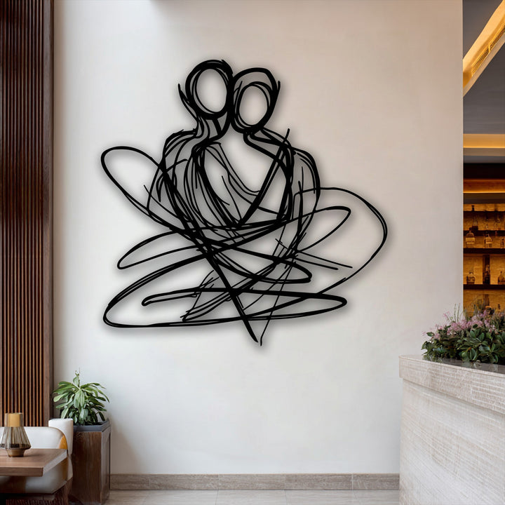 The striking black abstract couple unique metal wall art is the dominant feature, with its intertwined lines standing out against a bright wall.