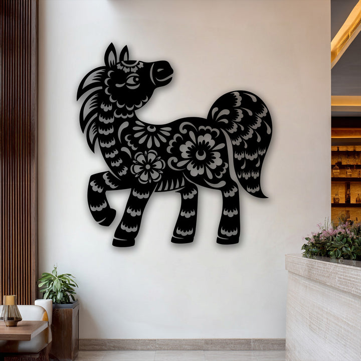 Cool and neutral color temperature pervades the scene, enhancing the intricate design of the unique metal wall art depicting a floral pony.
