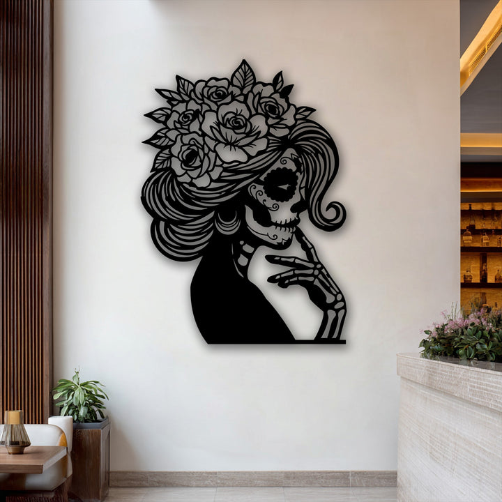 The warm color temperature of the inviting interior highlights the intricate Floral Sugar Skull Lady metal art for wall.