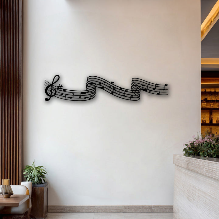 Horizontally oriented and beautifully shaped flowing melody notes metal wall decor with a wavy design.