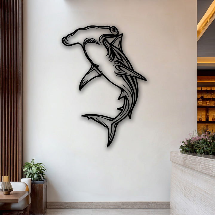 The darkest area, a striking black hammerhead shark metal art for wall, dramatically outlines the ocean predator's form.
