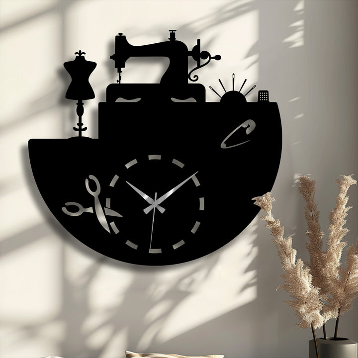 A striking black sewing-themed metal wall clock featuring a sewing machine and mannequin, making it bold decoration wall art.