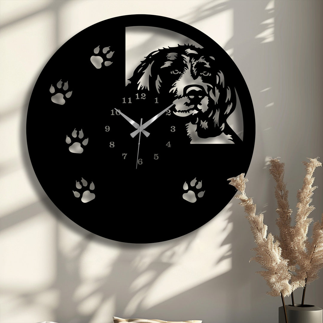 Prominent paw prints and sleek silver hands are visible on the lower face of this unique dog silhouette metal wall clock, showcasing decorative metal art.