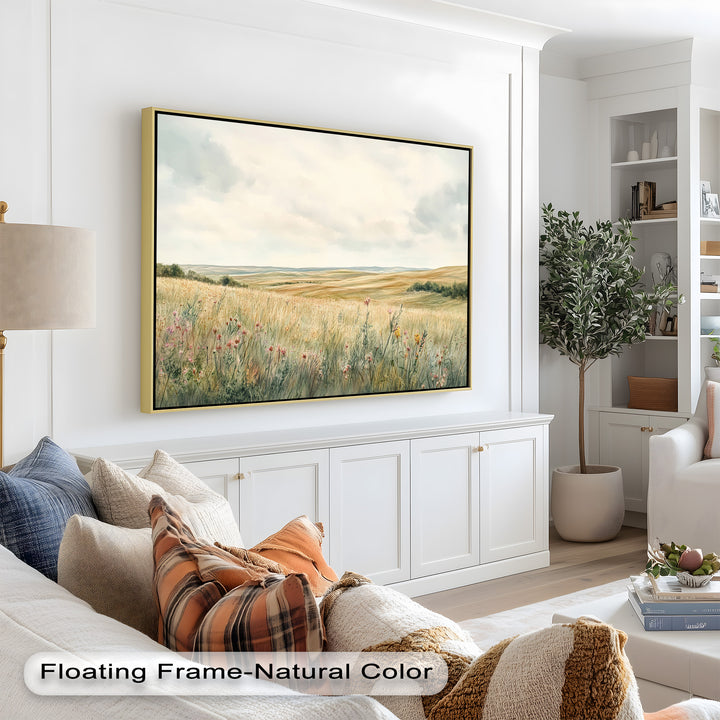A gentle pastoral scene featuring a wide field of grass and flowers, framed by distant hills and a muted sky.