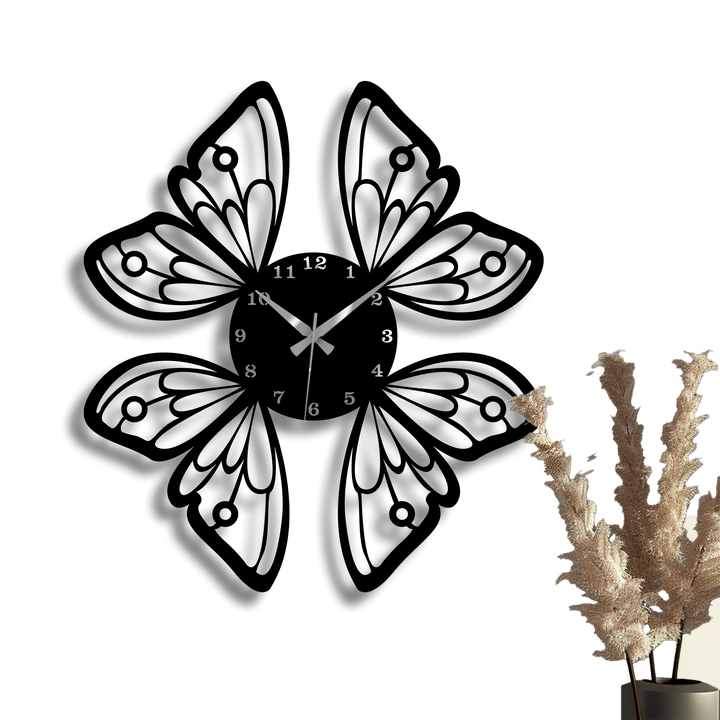 Dramatic light and shadow exquisitely define the intricate black butterfly wings metal artwork clock, casting sharp silhouettes on the bright wall.