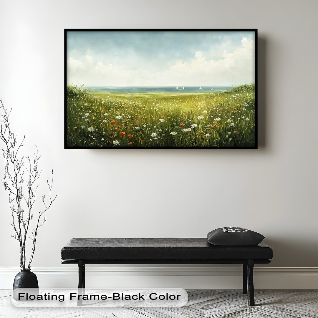 This cheerful landscape painting showcases a lush wildflower meadow gently sloping toward a calm, sail-dotted sea under a bright sky.