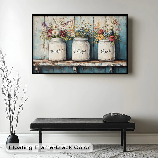 Rustic floral wall art with mason jars labeled Thankful, Grateful, Blessed.
