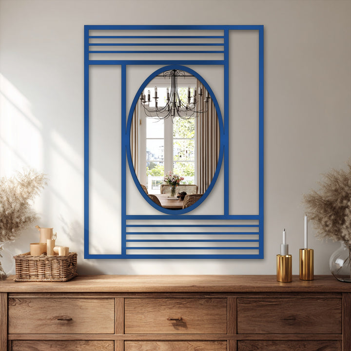 The cobalt bathroom mirror features a distinct geometric frame with structured lines forming the edge, offering a modern, balanced, oval reflection.