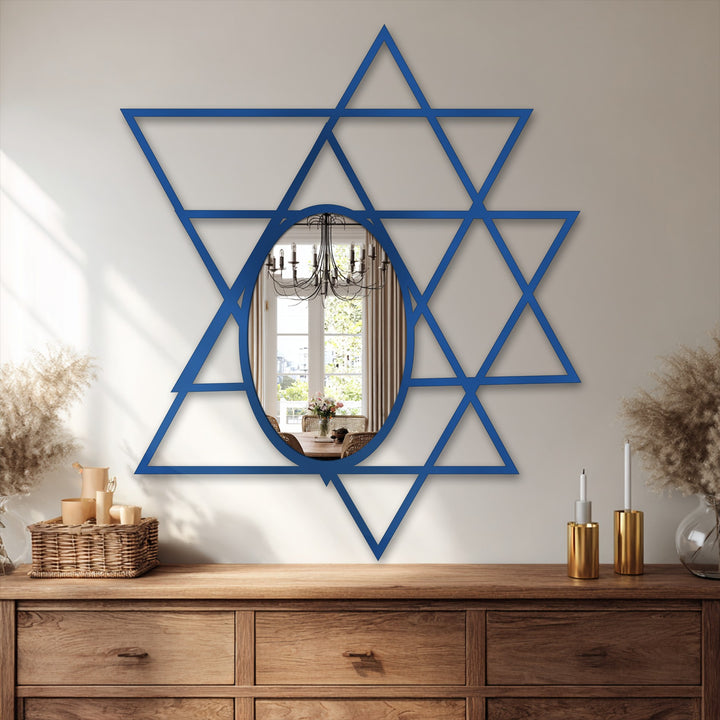 In the stillness, an intersecting triangles geometric oval floor mirror is a framed wall mirror reflecting the calm interior décor on a wooden cabinet.