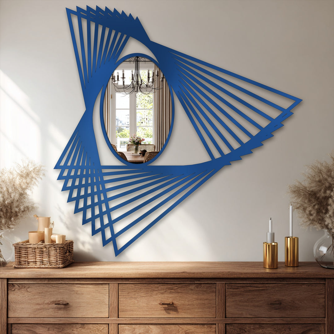 Angular shadow play emphasizes the modern geometric design of this reflective bathroom mirror, illuminating its abstract motion lines and oval center.