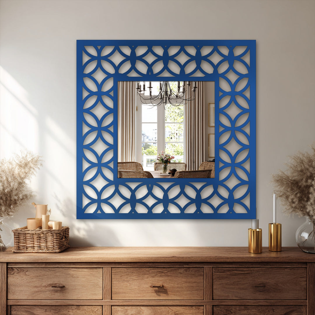 Smooth surface texture defines the geometric metal artwork of an interlocking circle pattern on this modern square framed wall mirror.