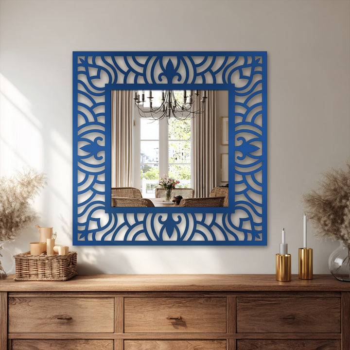 Reflected within the modern mirror's ornate wave frame is a softly lit dining area, creating depth in the background with muted tones.