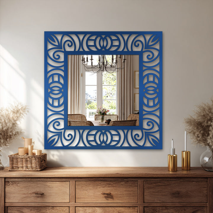 The ornamental scroll pattern of the framed wall mirror contrasts with the brightest areas in the reflected room scene, creating an intriguing decoration wall art piece.