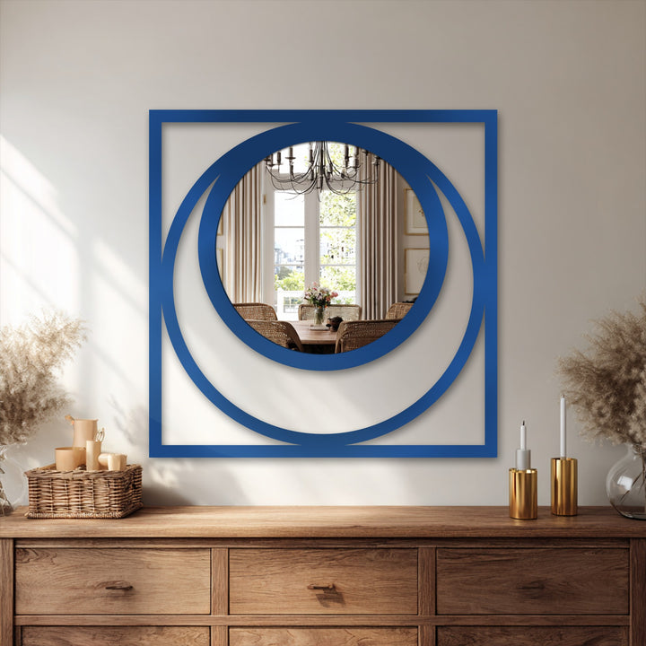 The brightest area reflects the interior dining space in this decorative mirror featuring a bold blue square and circular frame, creating a stunning eclipse effect.