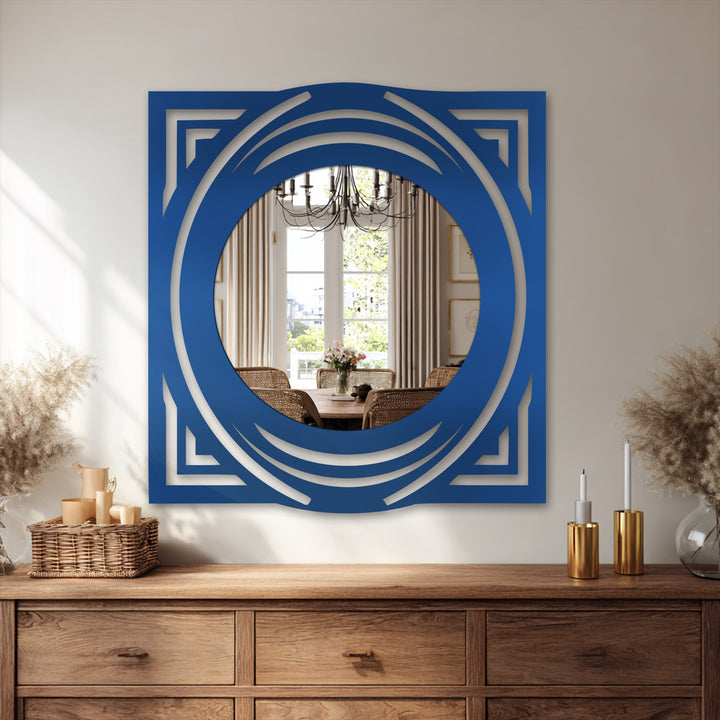 Realistic detail captures the cobalt-blue decorative mirror featuring a layered, geometric frame, reflecting a bright dining room in this example of home decoration.