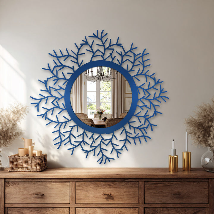 The darkest area highlights the botanical halo floor mirror's frame as a striking piece of unique metal wall art with its intricate leaf design and round central reflection.