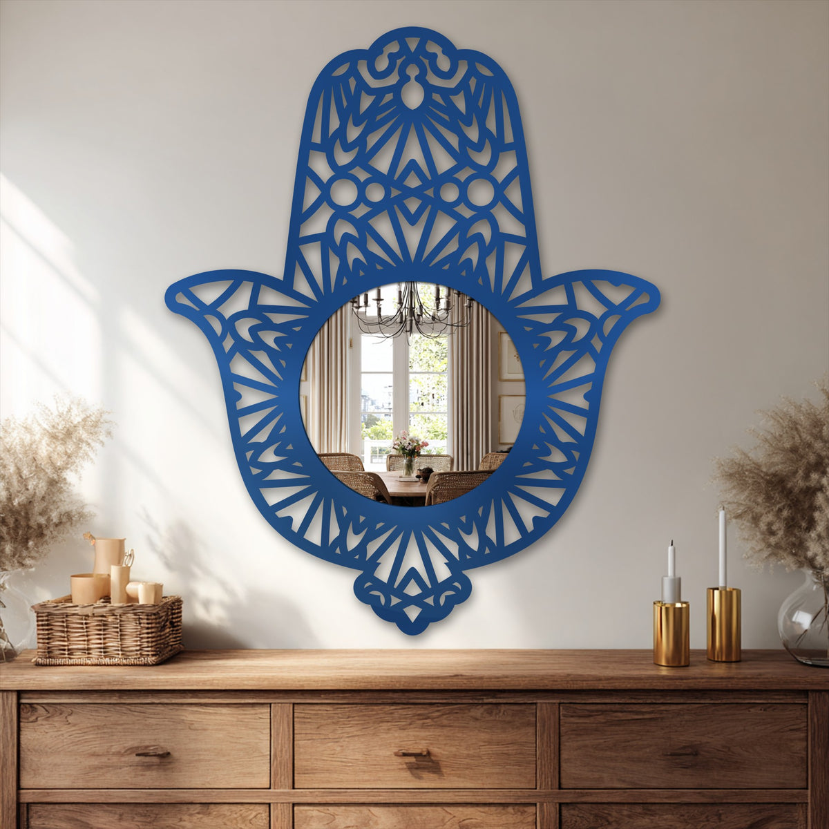Brilliant blue sacred hand metal artwork dominates, with a reflective mirror at the core, creating a visually arresting ornamental Hamsa design.