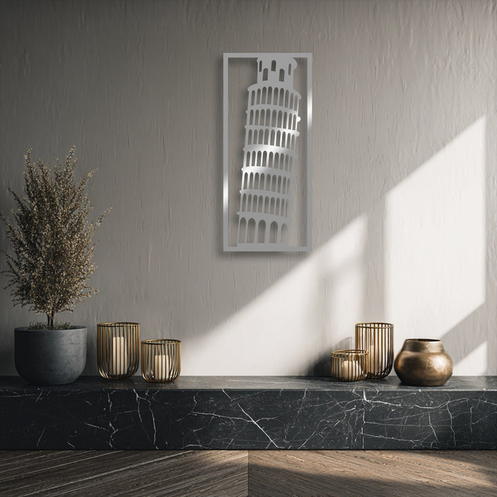 Rough plaster wall texture contrasts with the smooth, reflective decorative metal art and veined marble shelf below.