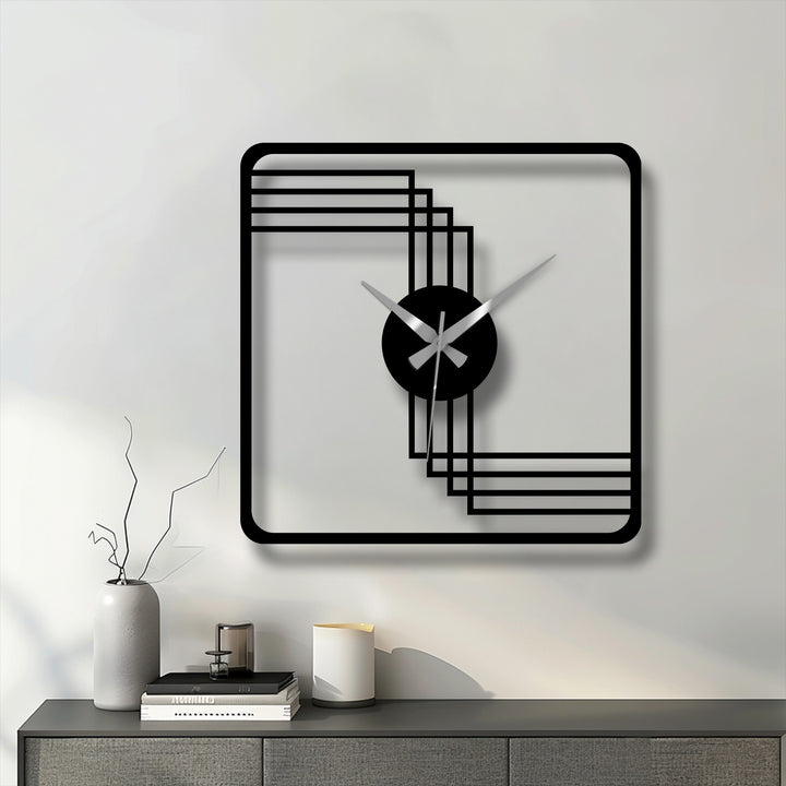 Black is the dominant color of this modern square frame geometric decorative metal art wall clock with a minimalist design.