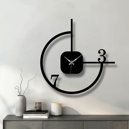 Showing the realistic detail, this minimalist geometric metal wall clock presents a striking metal artwork with its abstract circle design, enhancing any modern decor.