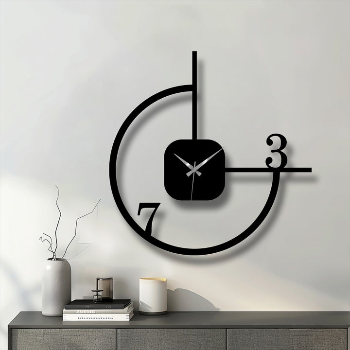 Showing the realistic detail, this minimalist geometric metal wall clock presents a striking metal artwork with its abstract circle design, enhancing any modern decor.