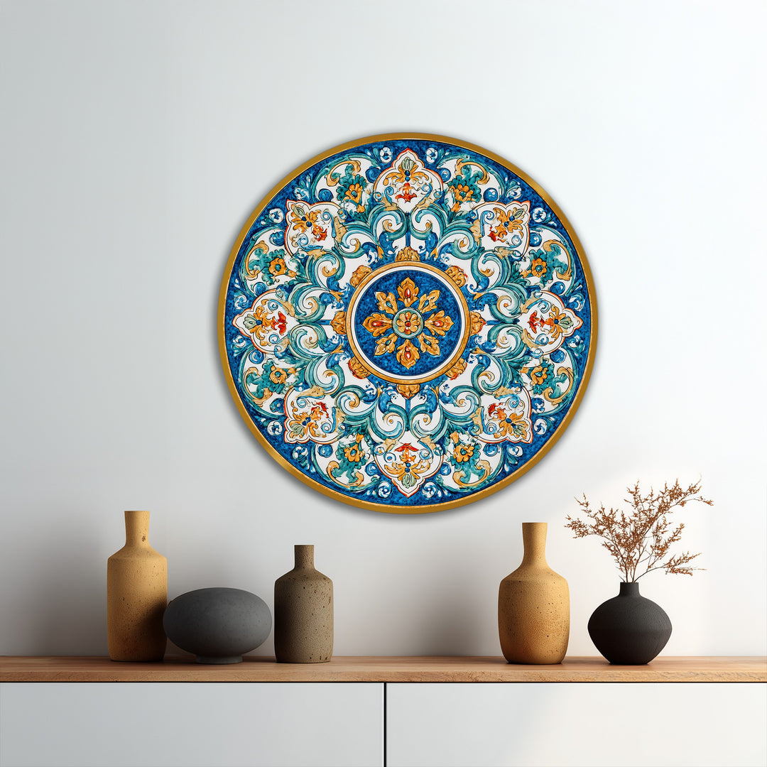 Seen in the darkest area, this vibrant, Mediterranean-inspired round oil painting art piece features azure and gold ornamental details in a classic mandala design.