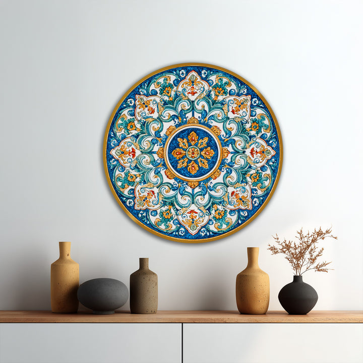 Seen in the darkest area, this vibrant, Mediterranean-inspired round oil painting art piece features azure and gold ornamental details in a classic mandala design.