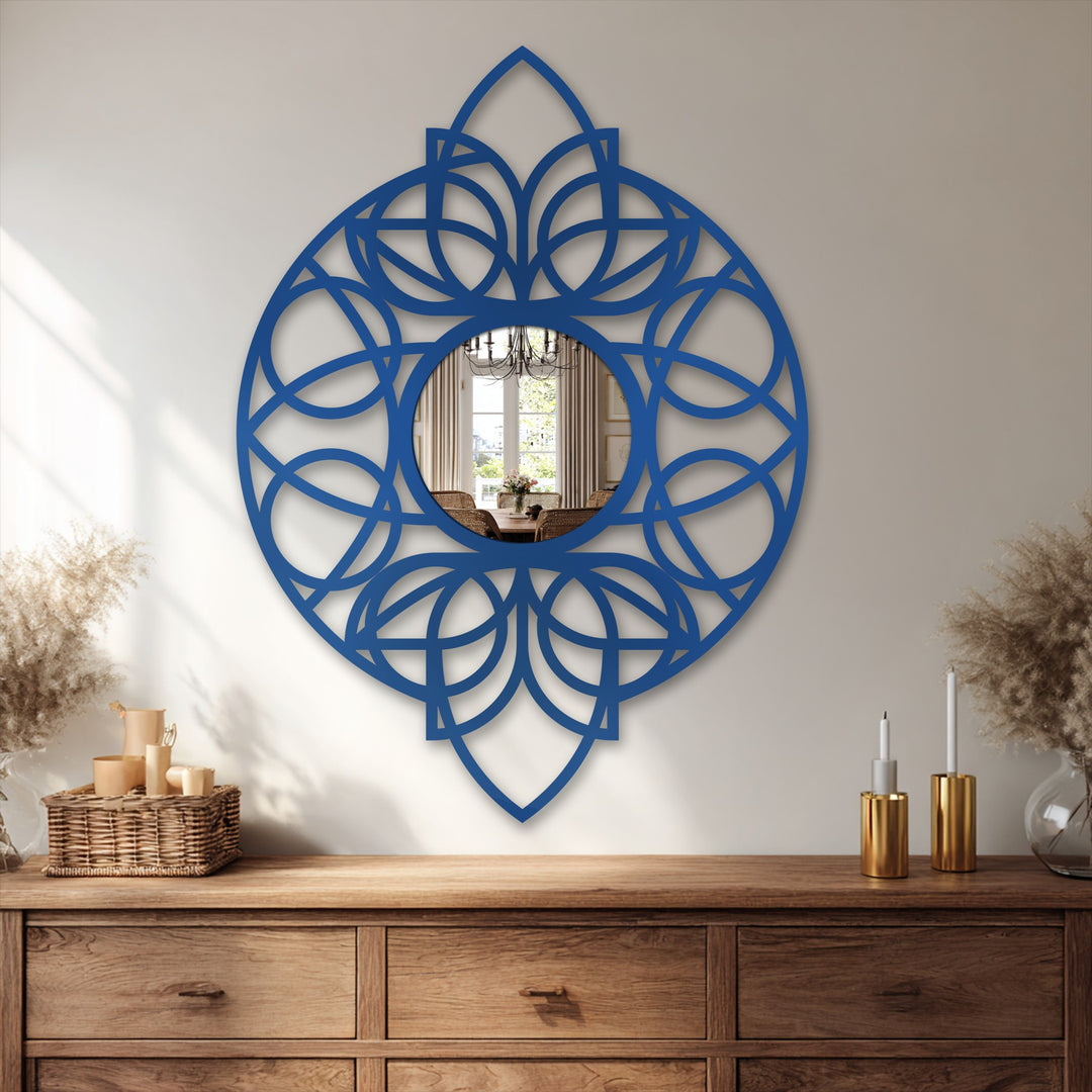 Visual rhythm is created by the circular, repeating geometric pattern of this blue framed wall mirror, enhancing the interior's design.
