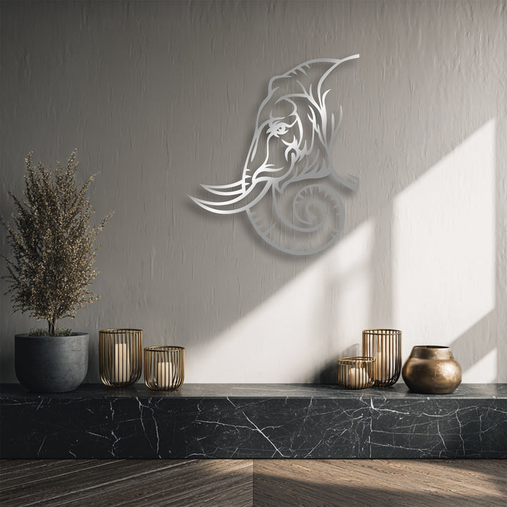 The crisp, clean edges and borders of the silver majestic elephant line art metal decoration wall art stand out against the textured grey wall.