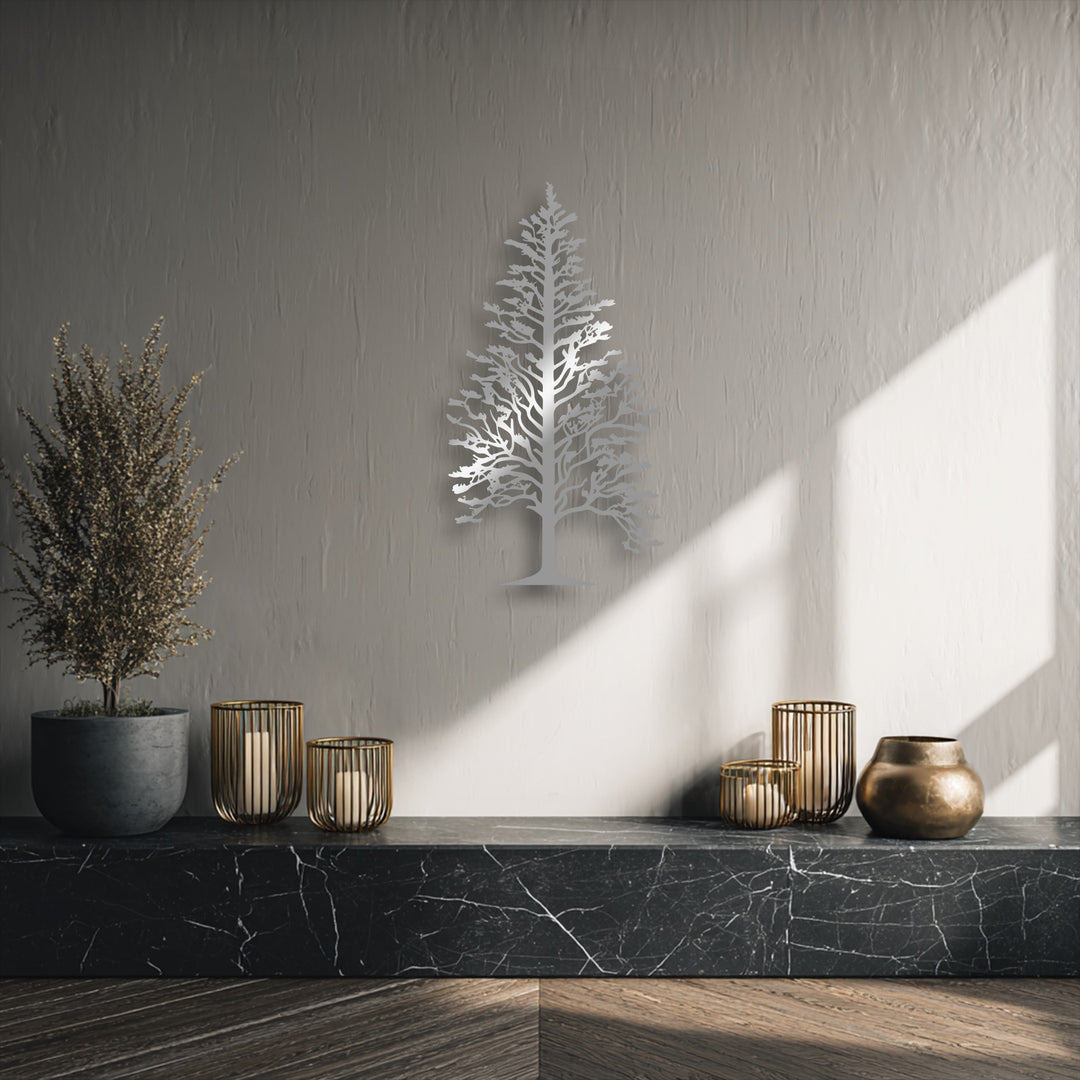 The background showcases a subtly textured light gray wall, creating an elegant backdrop for the majestic pine tree metal wall decor.