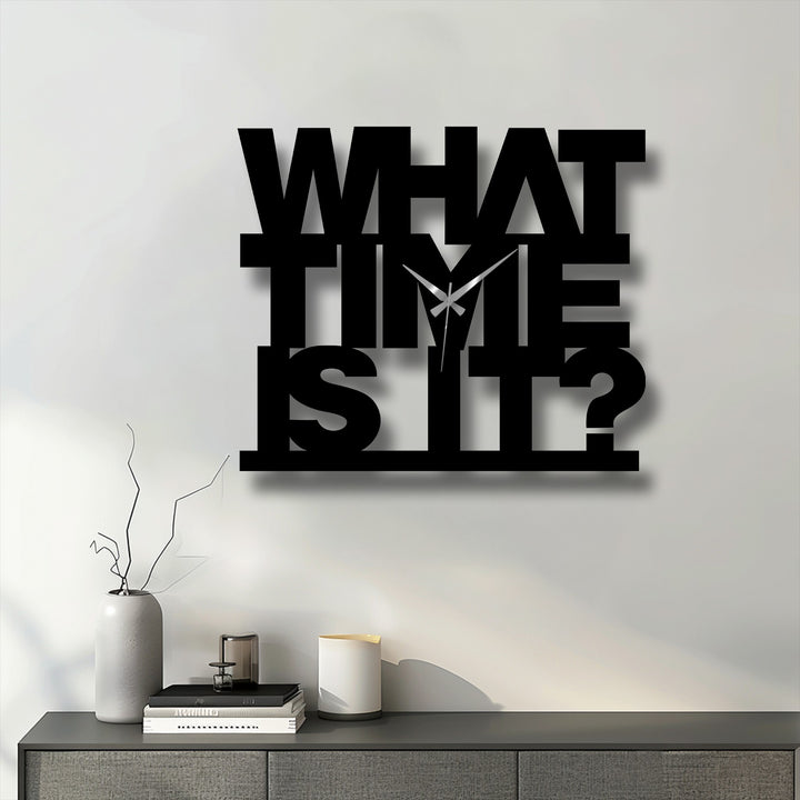 The striking, all-caps 'What Time Is It?' decoration wall art serves as the loudest element in this bold and modern metal wall clock design.