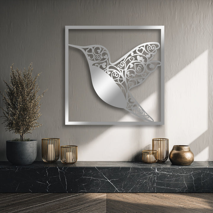 Soft shadows and bright highlights accentuate the intricate hummingbird heart metal decoration wall art, creating depth and visual interest.