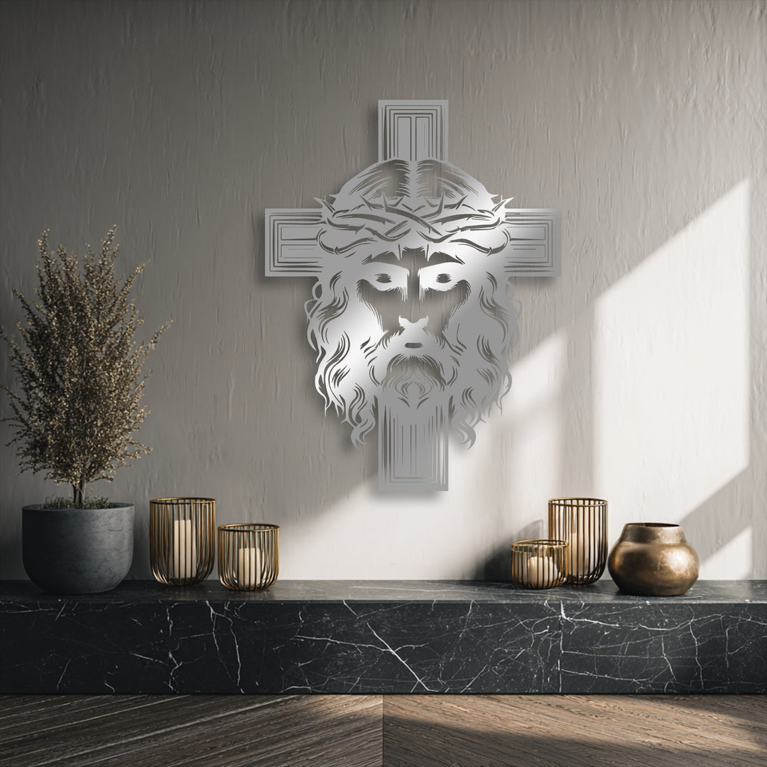 Negative space defines the intricate Jesus face and cross design, casting subtle shadows on the textured wall behind the religious metal art for wall.