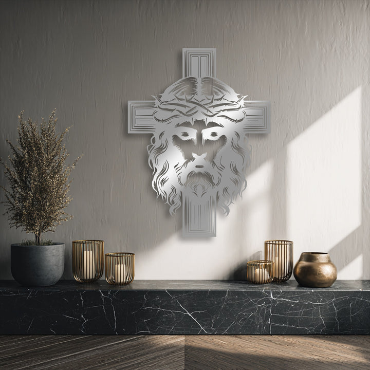 Negative space defines the intricate Jesus face and cross design, casting subtle shadows on the textured wall behind the religious metal art for wall.
