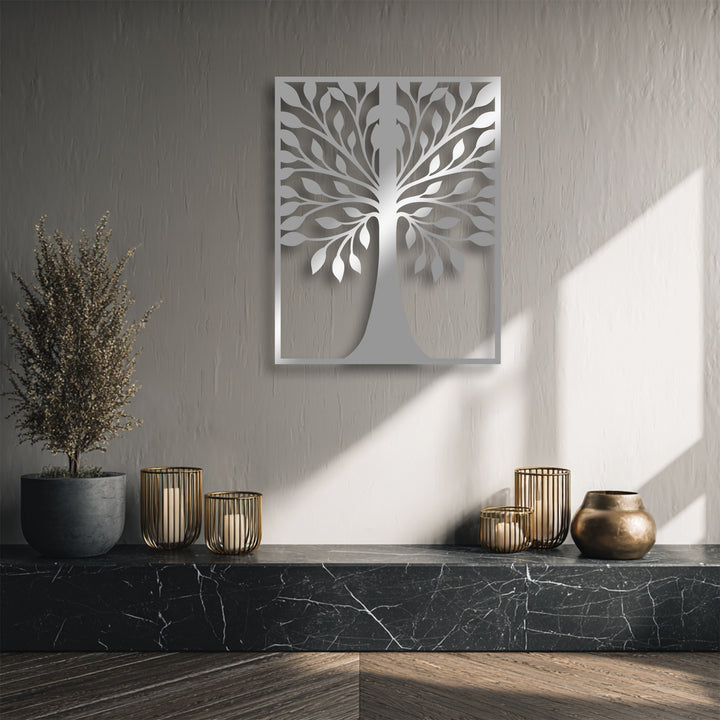 Muted grey tones dominate this serene display featuring symmetrical leaf tree silhouette metal wall decor.