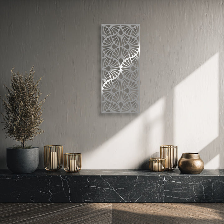 Against a subtle greige wall, the ornate fan pattern of the unique metal wall art stands out with its geometric elegance.