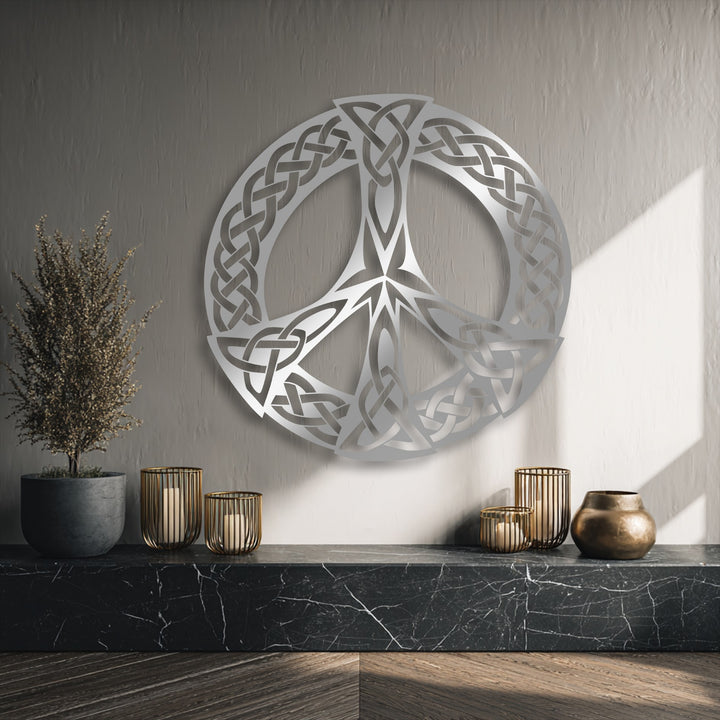 The elegant silver Celtic Knot Peace Symbol Metal Wall Art serves as a stunning piece of decoration wall art on a textured wall.
