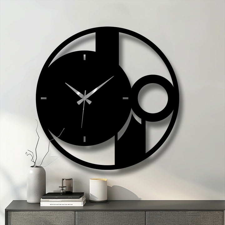 Depicting the darkest area of the abstract minimal circle metal art for wall, this contemporary clock casts dramatic shadows on the clean, white wall.