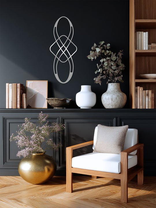 The geometric infinity metal wall art sculpture creates intriguing depth and layers, offering a striking display of unique metal wall art with its abstract black finish.