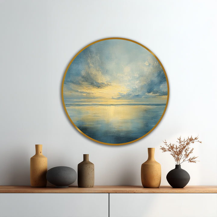Displayed prominently, a captivating oil painting home decor piece captures a tranquil horizon with golden light reflecting on the still sea in a round, framed canvas.