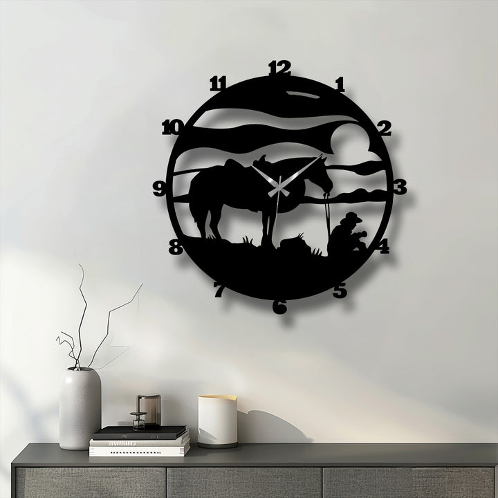 Relatively muted color saturation enhances the stark silhouette of the cowboy horse metal wall clock, showcasing its rustic, unique metal wall art ranch design.
