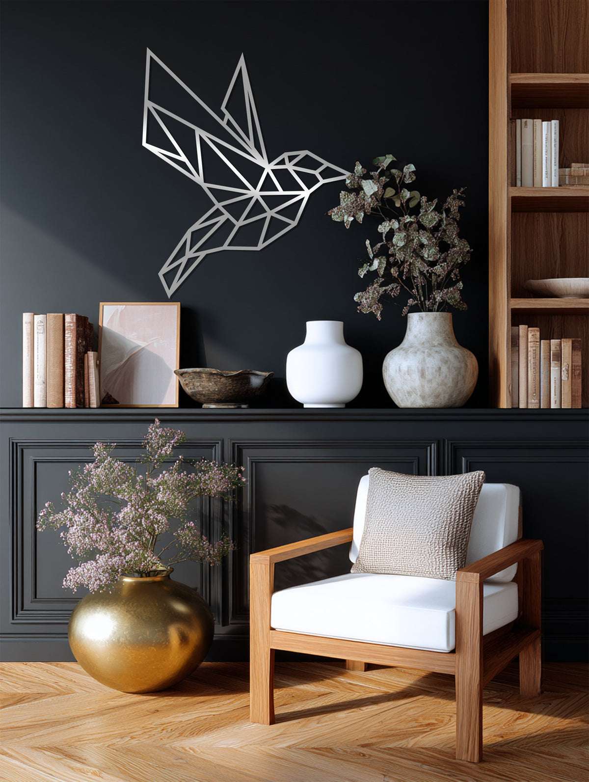 Textured geometric hummingbird unique metal wall art shows a smooth, flat surface with an intriguing play of light and shadow across its polygons.