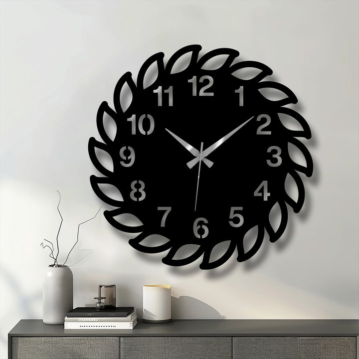 Low color saturation enhances the modern, black leaf frame of this decorative metal art wall clock, creating a sophisticated and minimalist aesthetic.