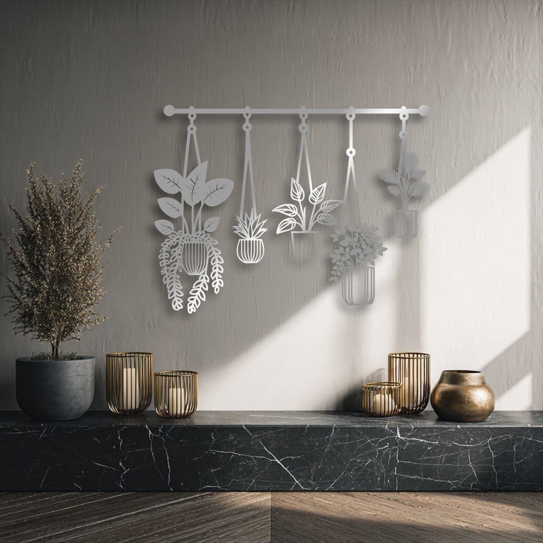The textured light gray wall background with subtle shadows beautifully highlights the modern hanging plants unique metal wall art.
